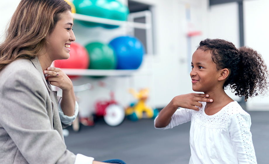 speech therapist working with child
