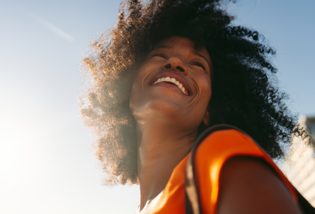 Black woman smiling outside